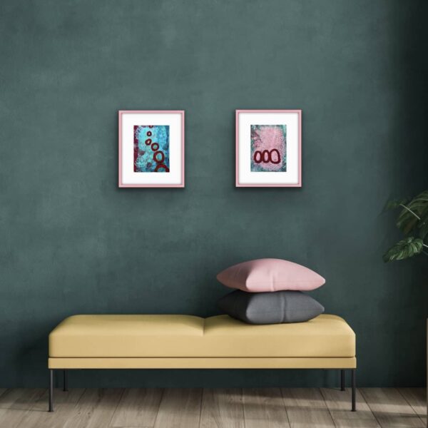 Both Saturn Sister abstract paintings with pink pillow